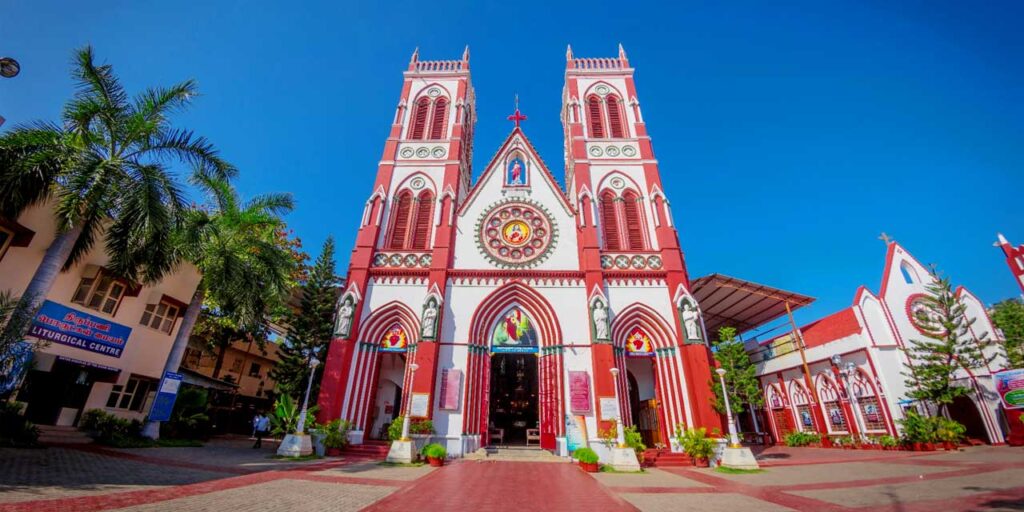 Front view of the Basilica of the Sacred Heart of Jesus in Pondicherry with Gothic architecture and stained glass windows.